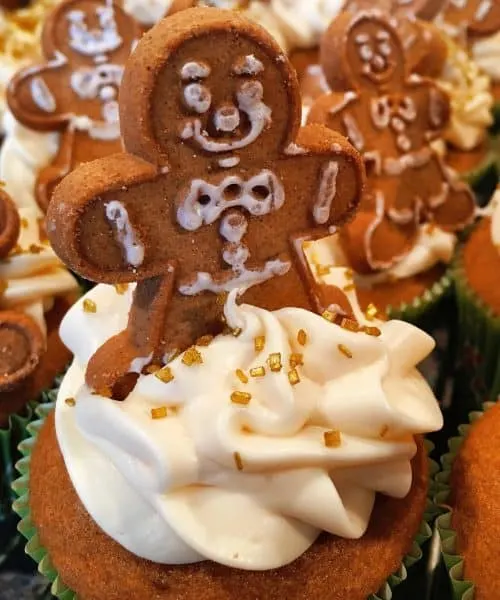 gingerbread man cookie on top of ginger ale spiced cupcakes
