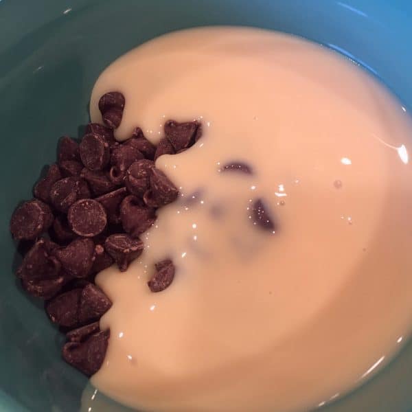 chocolate chips with condensed milk in bowl