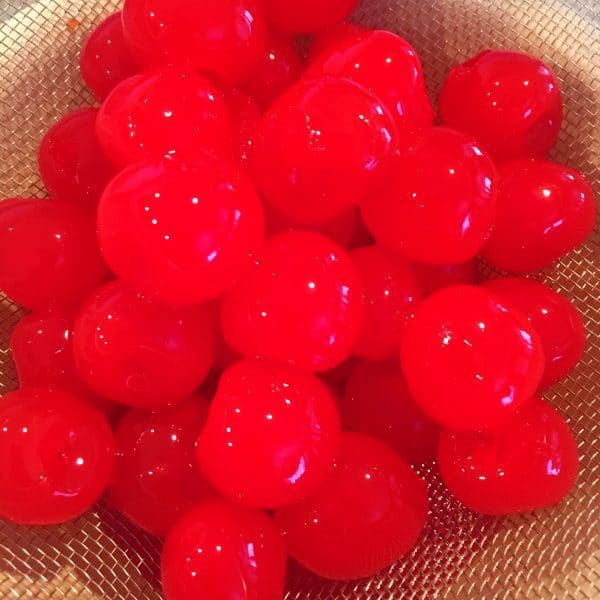 Whole cherries drained in strainer