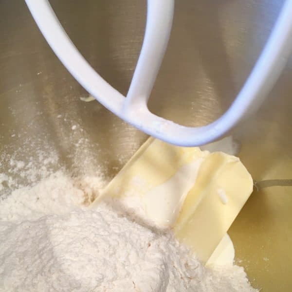 Butter and Powder Sugar in the mixing bowl mixing