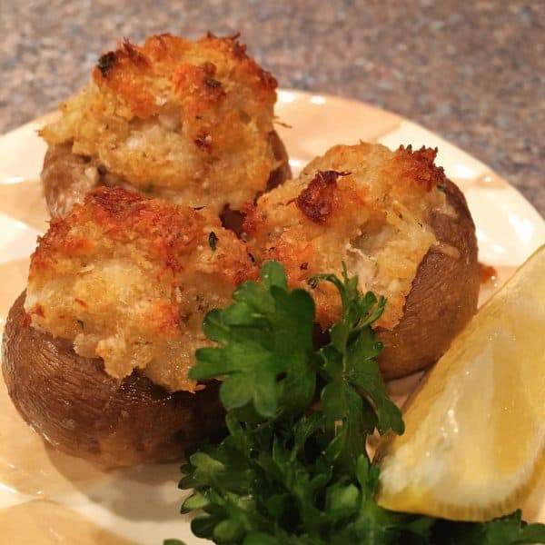 Crab Stuffed Mushrooms on a plate ready to eat.