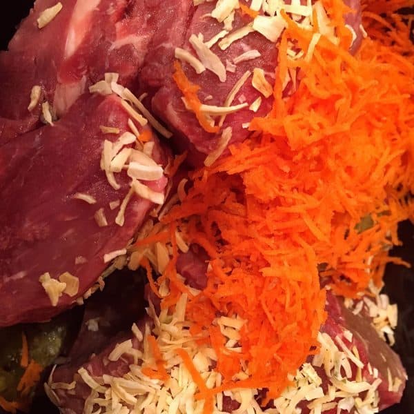 Beef, shredded carrots, dried onions, and beef broth for tamale filling