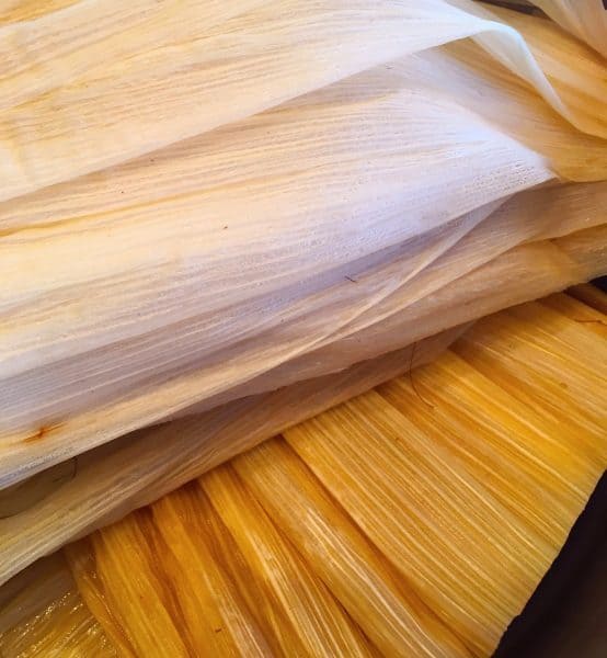 Corn husks soaking in water