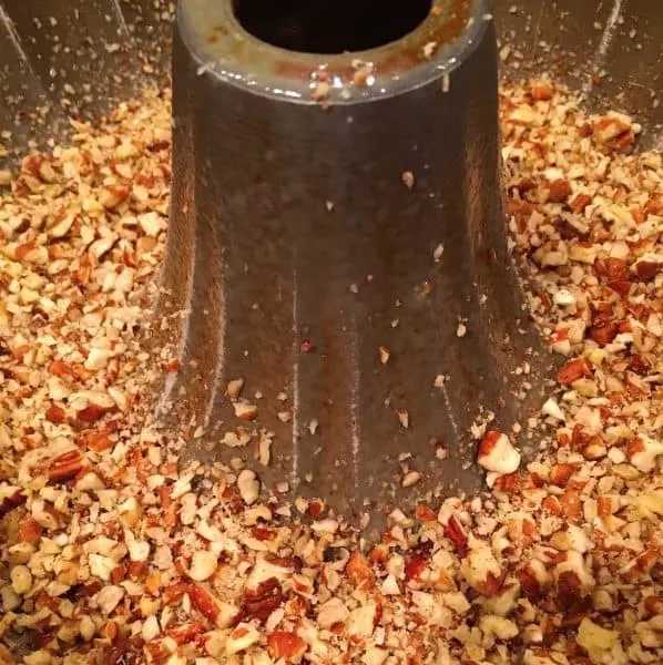 Bundt pan sprayed with cooking sleep and pecans in the bottom of the pan