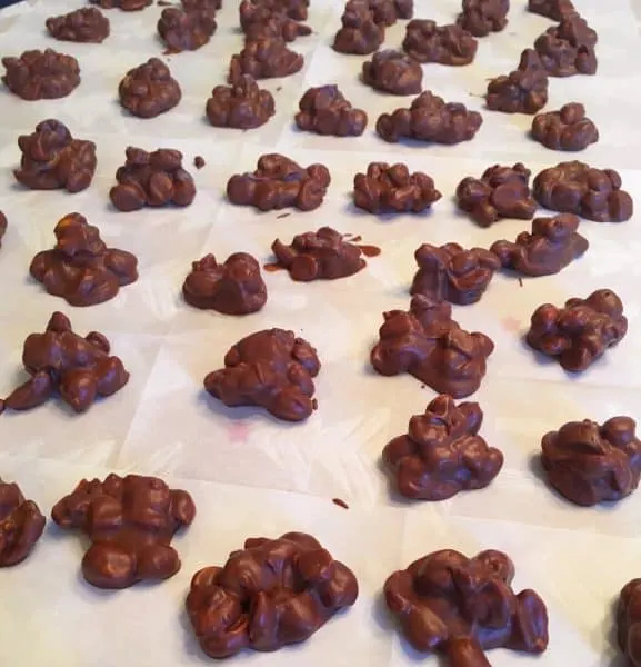 Peanut clusters on wax paper setting up
