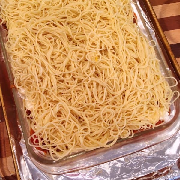 More Spaghetti on top of cheese and sauce