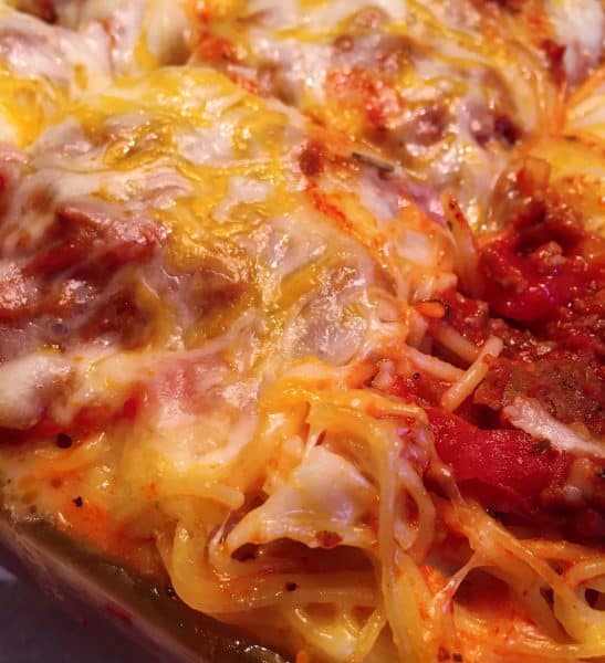 casserole dish full of baked meat lovers spaghetti