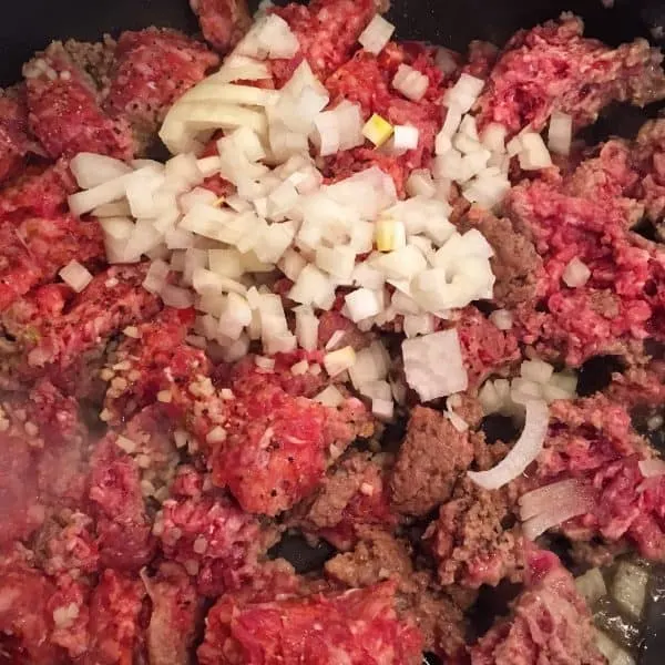 Ground beef, onions, and garlic in frying pan