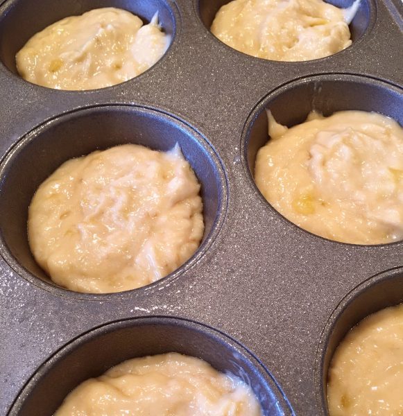 Muffin tin filled with banana batter