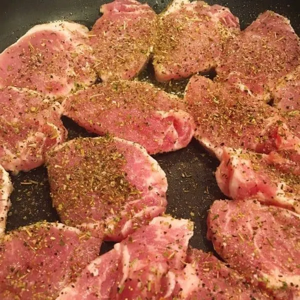 Frying pork medallions in a fry pan