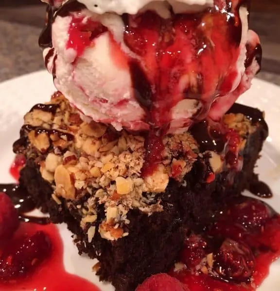 Dark Chocolate Brownie with scoop of Raspberry Gelato and Raspberry Syrup