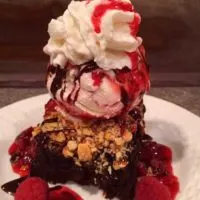 A brownie sundae with ice cream and whipped cream