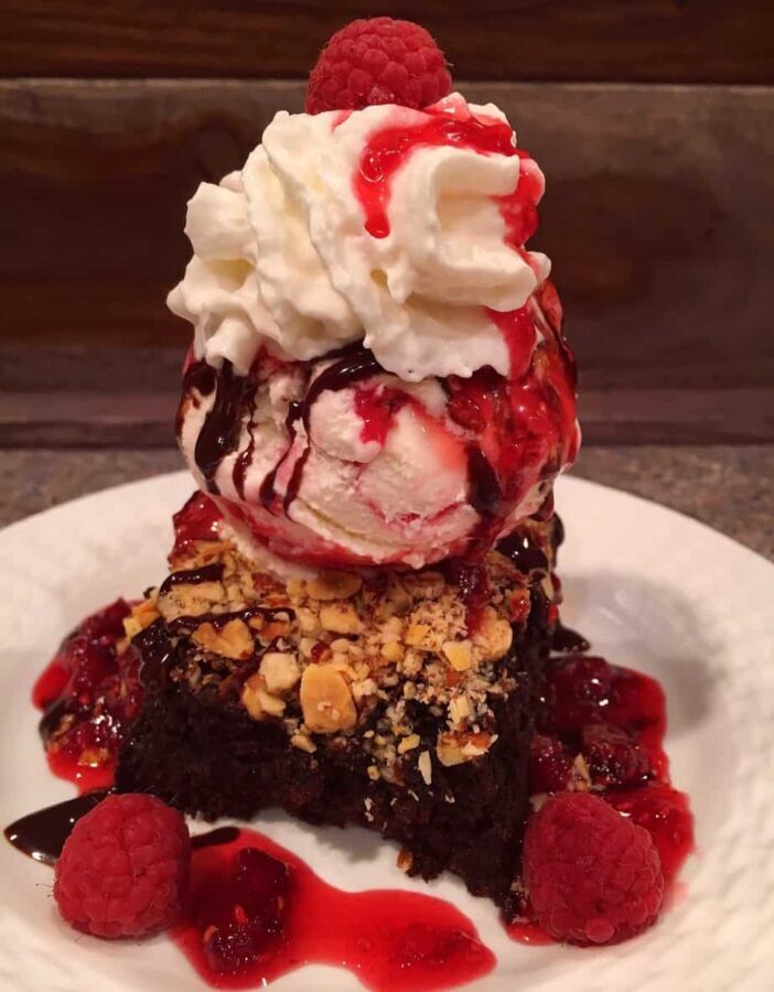 A brownie sundae with ice cream and whipped cream