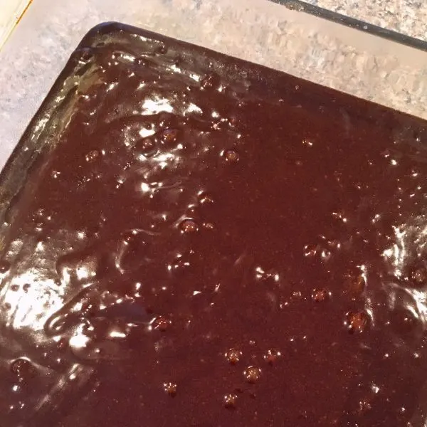 Brownie batter in an 8 x 8 pan ready to bake