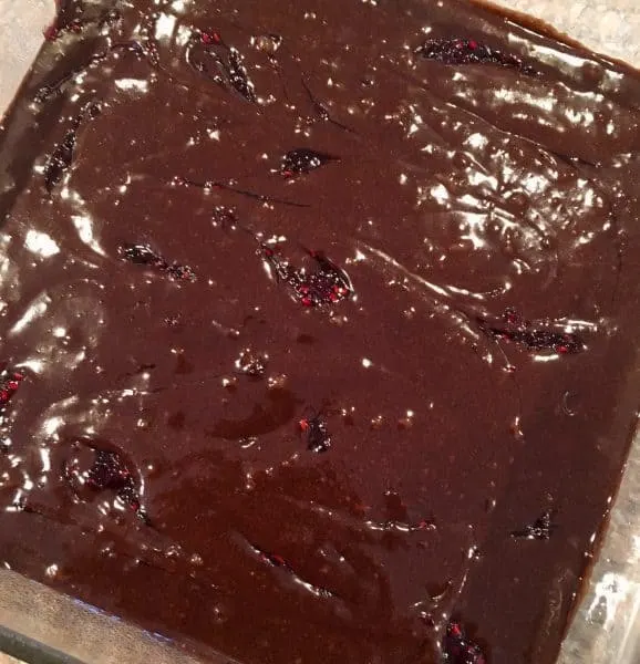 Raspberry jam swirled through the dark brownie batter