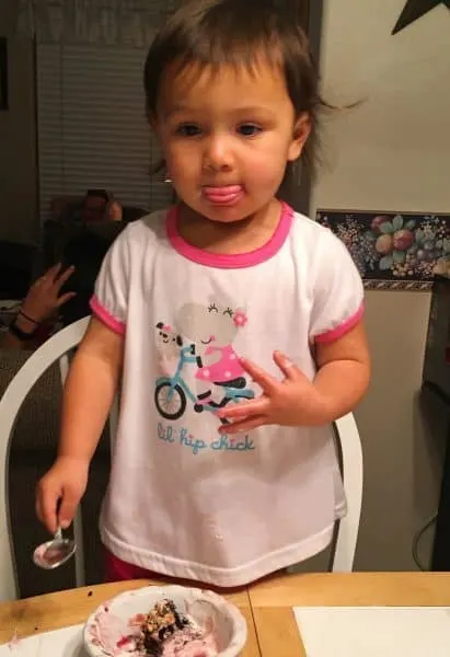 Grandbaby eating raspberry sundae