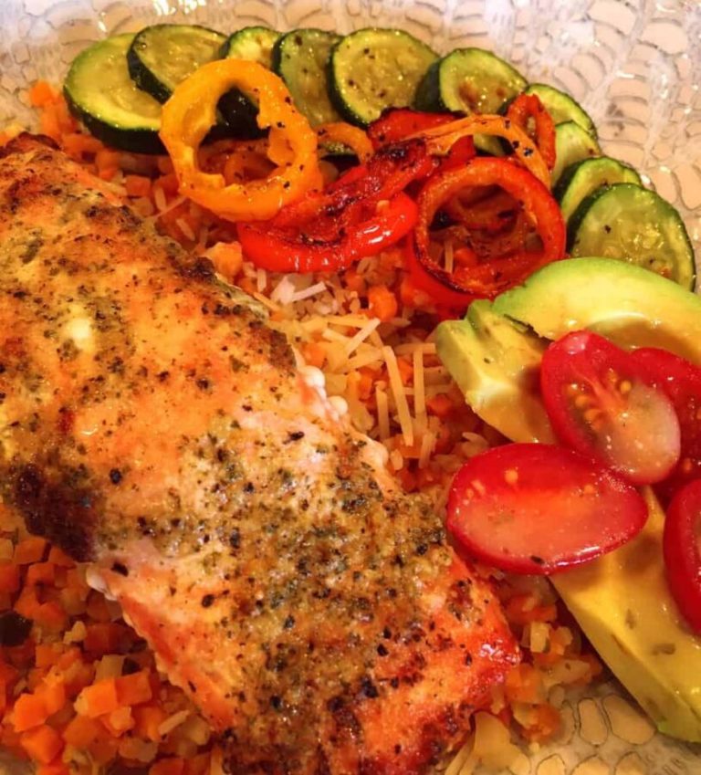Salmon Bowls in a bowl with baked salmon, veggie rice, and fresh vegetables.