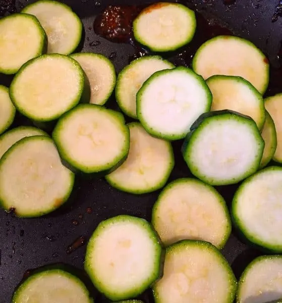 Sliced squash frying in skillet to go with Teriyaki Chicken