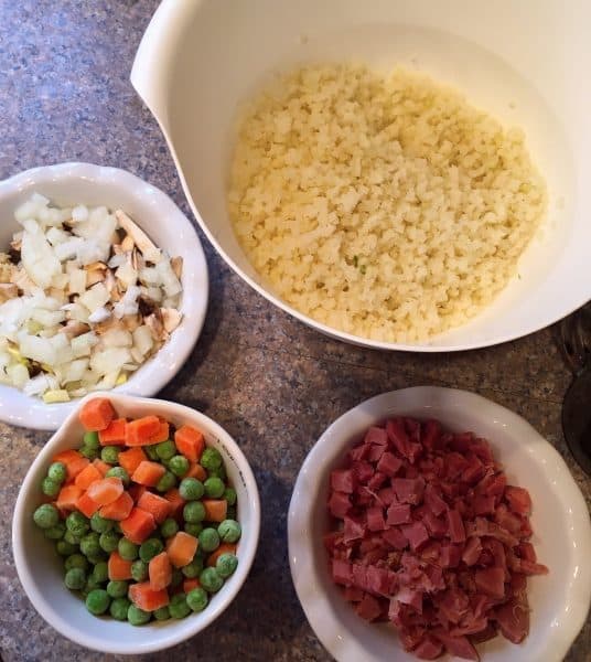 Ingredients in separate bowls for Cauliflower fried rice
