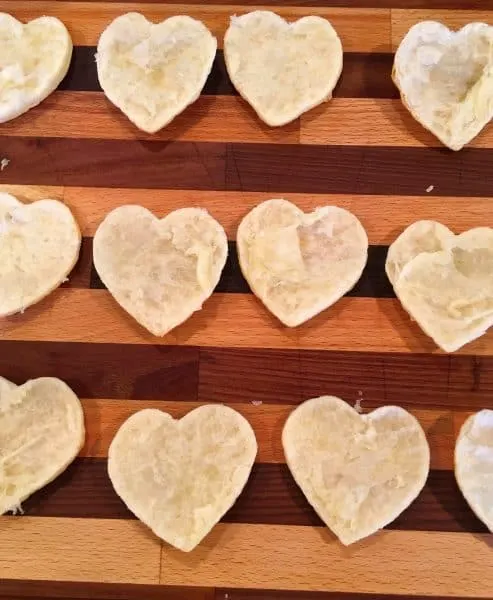 Baked Puff Pastry on a cutting board split in half