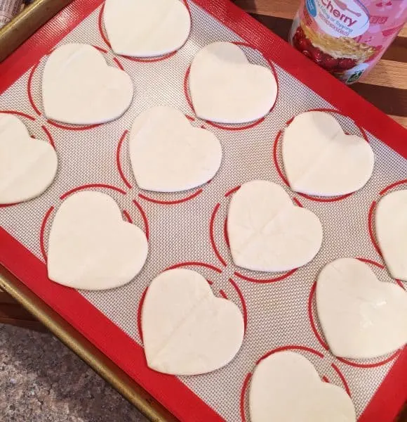 Heart Cut Outs on Silicone Mat and baking sheet.