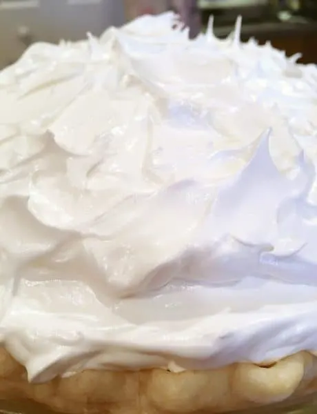 Meringue topping on top of the pie ready for the oven