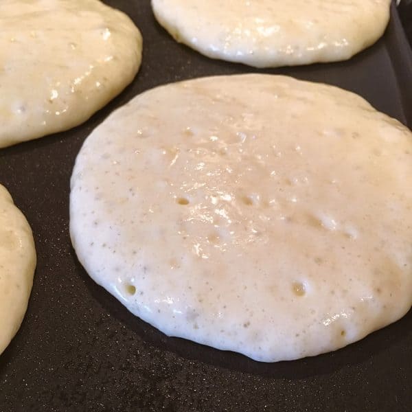 Pancake Batter on hot griddle baking