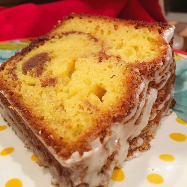 Slice of Cake Mix Cinnamon Coffee Cake on pretty polka dot plate with flowers.