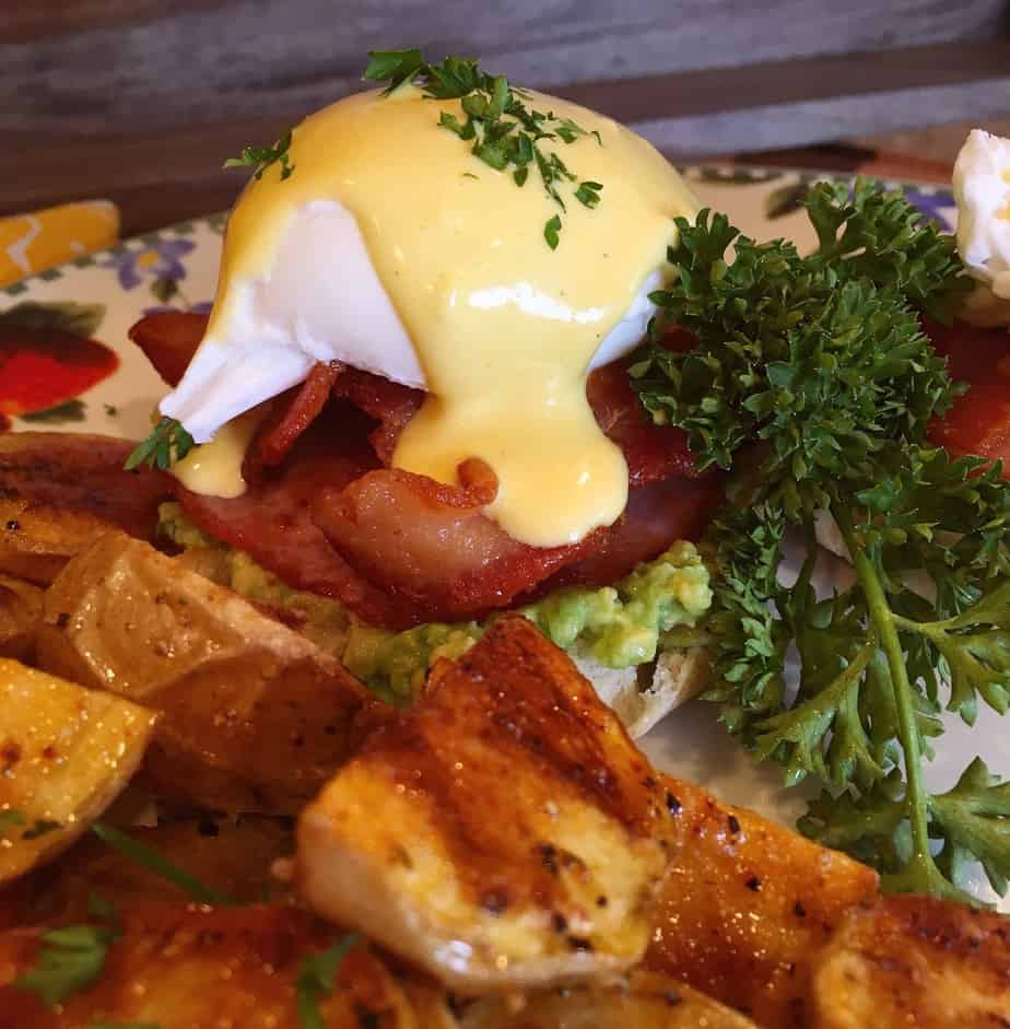 Plate with Eggs Benedict and roasted baby potatoes