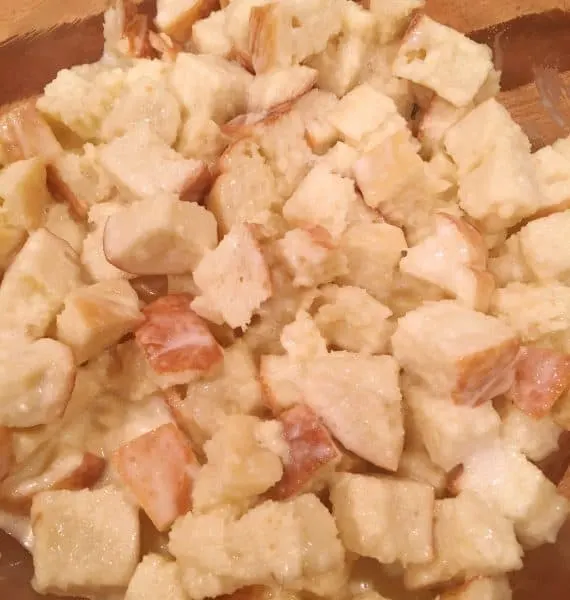 9 x 13 glass baking dish, prepped with baking spray and 3/4 of the bread mixture spread in the bottom of the pan.