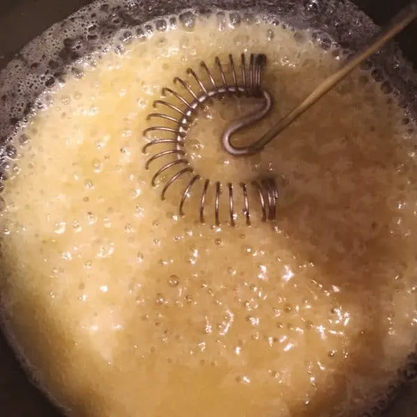 Sauce pan with melted butter and flour to create Vanilla Cream Sauce for Bread Pudding.