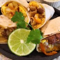 Plate full of heated breakfast burritos