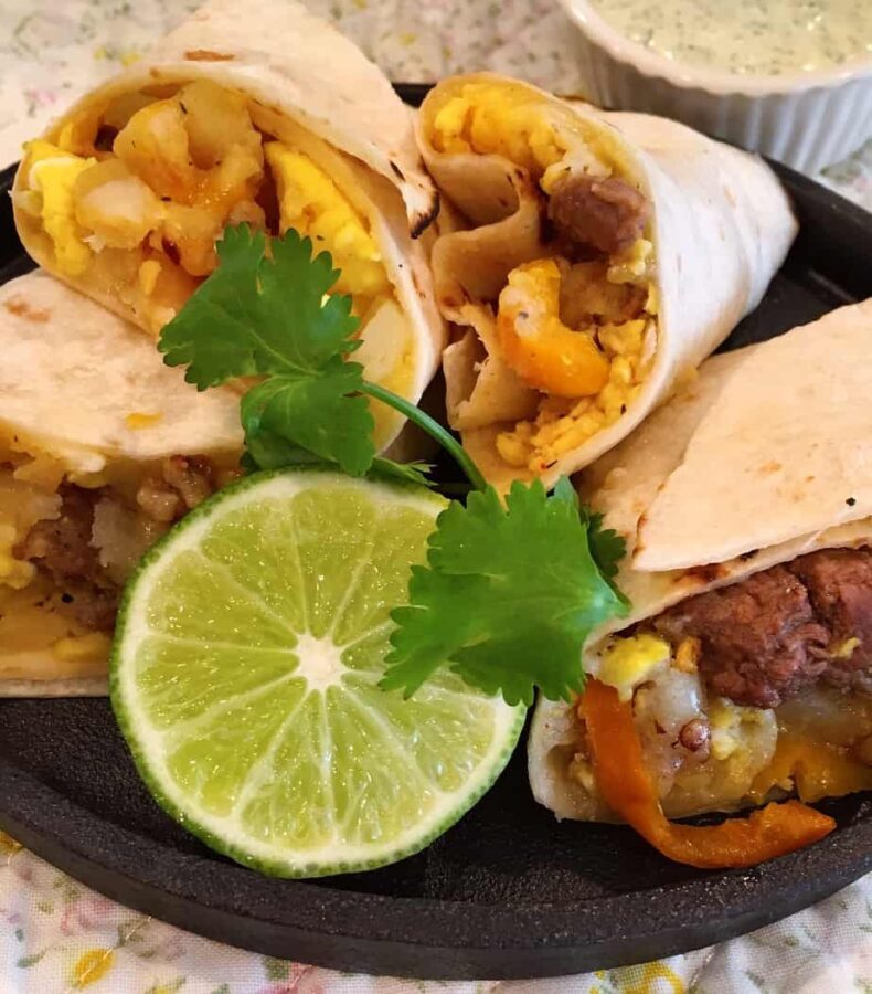 Plate full of heated breakfast burritos 