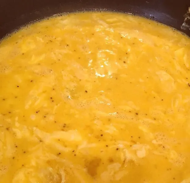 Scrambled Eggs cooking on stove top