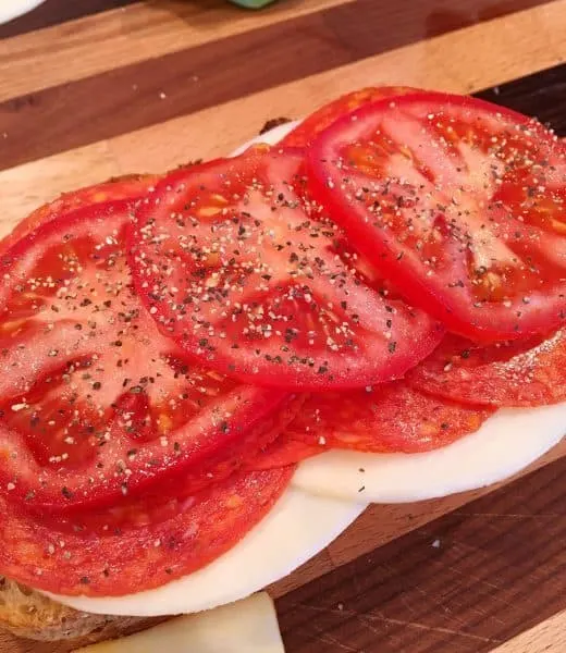Italian Grilled Cheese Preparation with layer of fresh tomatoes