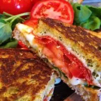 Thick Slices of golden toasted Rosemary Garlic Bread with Pepperoni, cheese, and Tomatoes