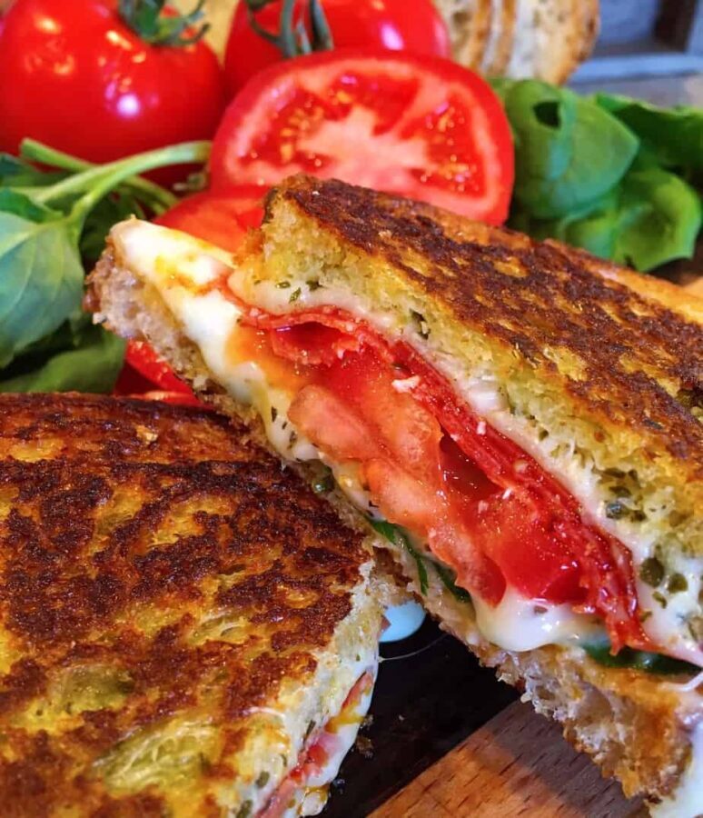 Thick Slices of golden toasted Rosemary Garlic Bread with Pepperoni, cheese, and Tomatoes