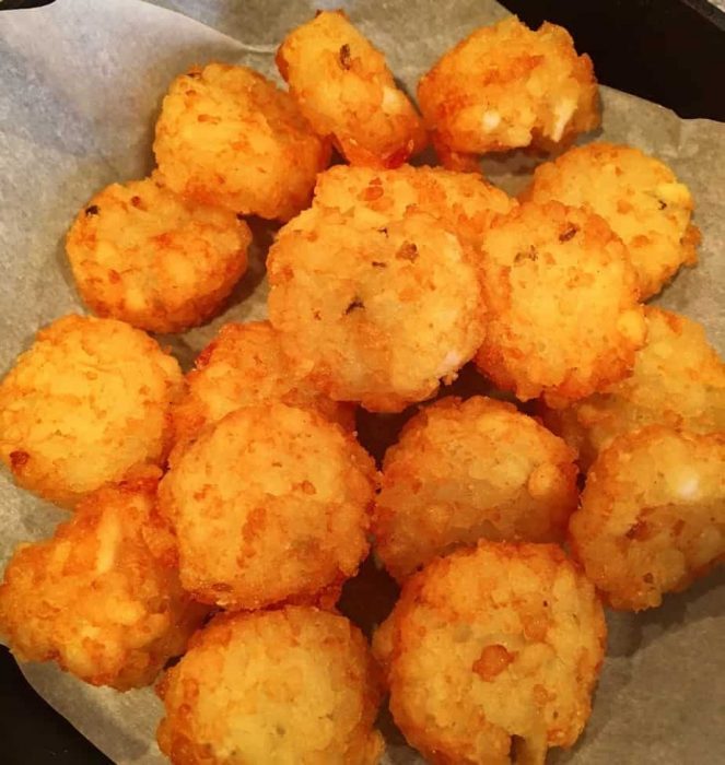 Parchment lined baking dish with crispy crowns