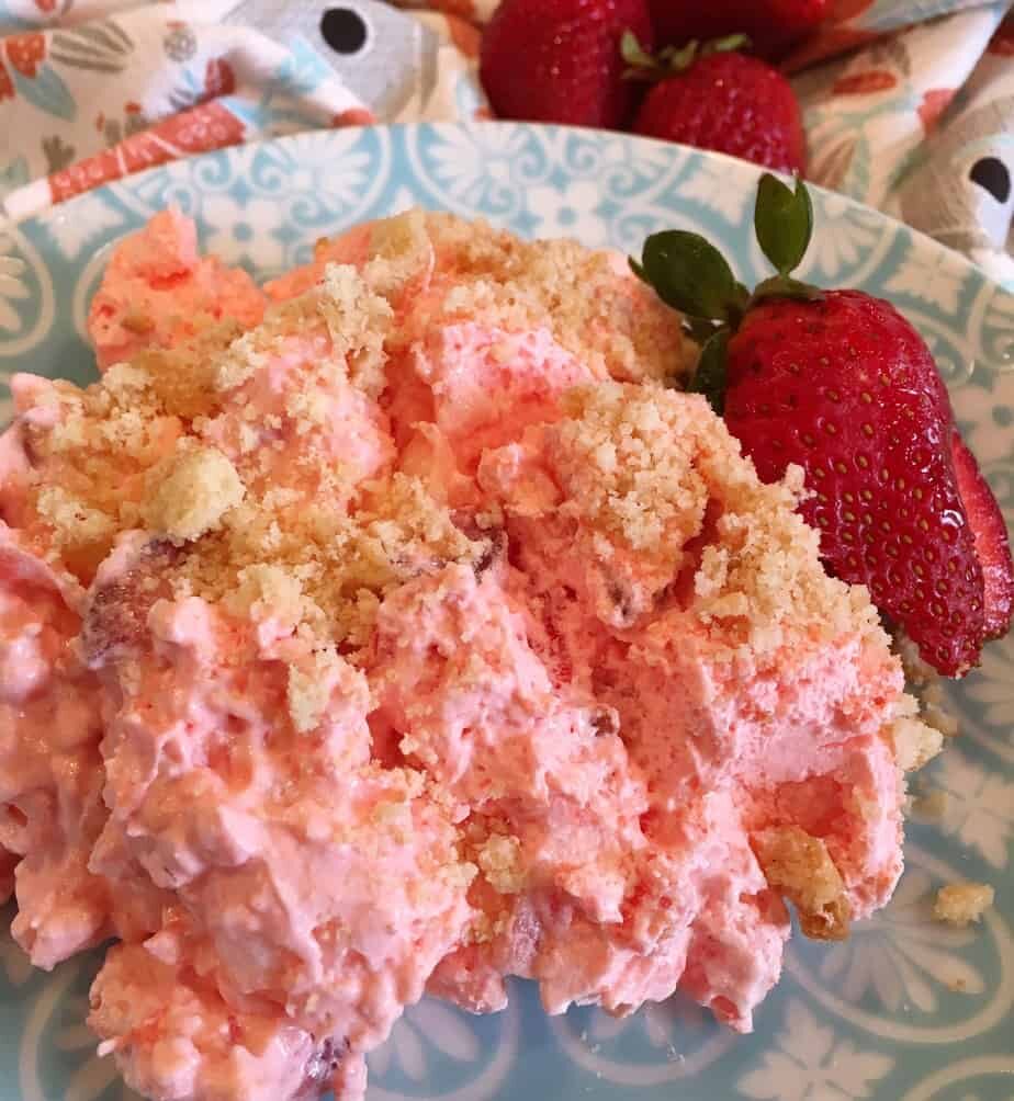 Serving of Strawberry Pineapple Fluff Jello Salad on Teal Plate