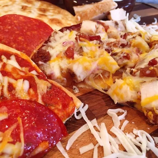 Slices of Pepperoni and BBQ Chicken Personal Pan Flat Bread Pizzas