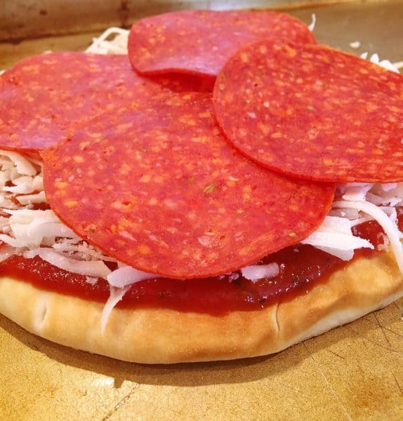 Pepperoni on top of the flat bread