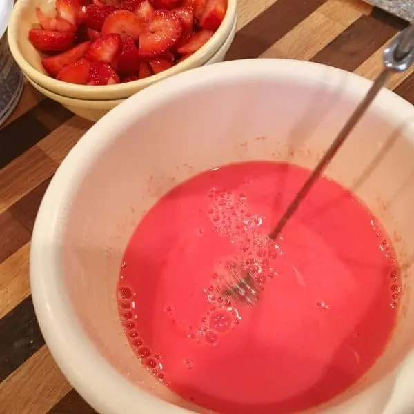 Small bowl with one 3 oz. package of strawberry jello and 1 cup of milk