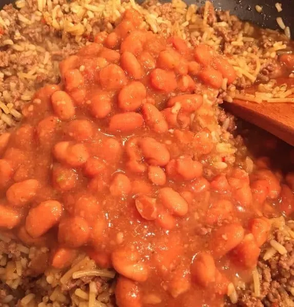 Adding Pinto Beans to meat and rice mixture