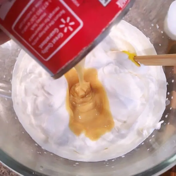 Adding sweetened condensed milk to whipping cream