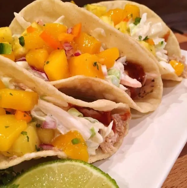 Three Island Tacos lined up on a plate