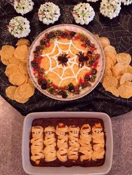 Halloween party food including mummies in a graveyard