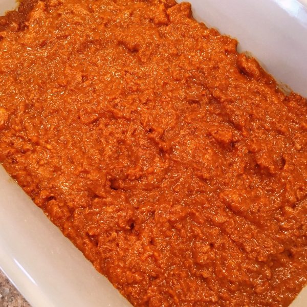 canned chili spread in a casserole dish