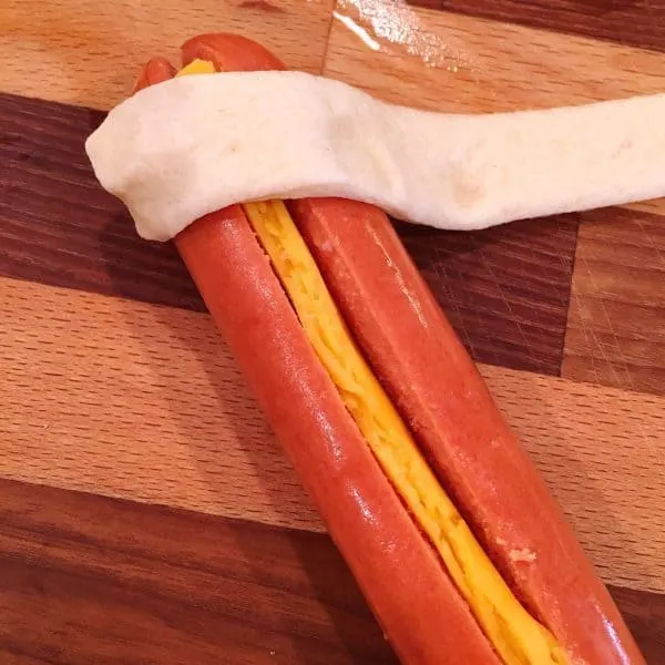 crescent dough rolled around the hot dog