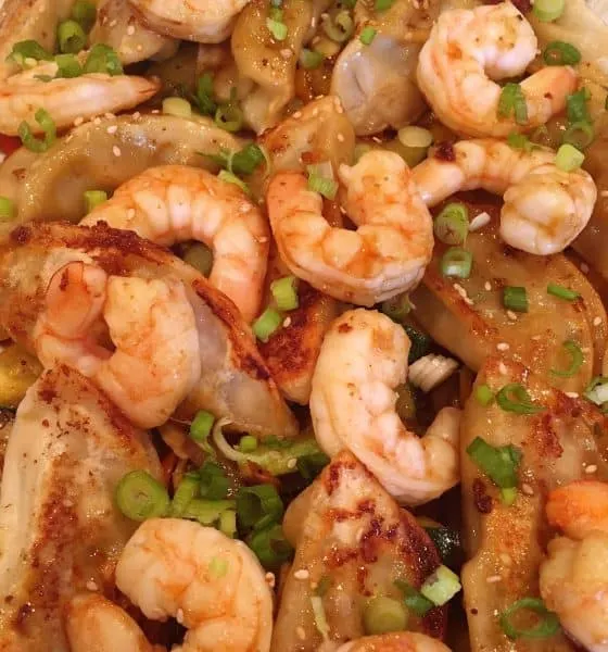 Potstickers with Shrimp layered on Vegetable Stir Fry