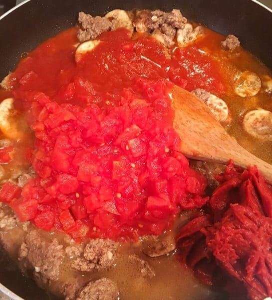 Pan with tomatoes, meat, tomato sauce, water,